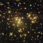 Bright yellow-white galaxies fill the field of view. A few foreground stars dot the scene in the upper half of the image. Faint arcs of gravitationally lensed background galaxies.