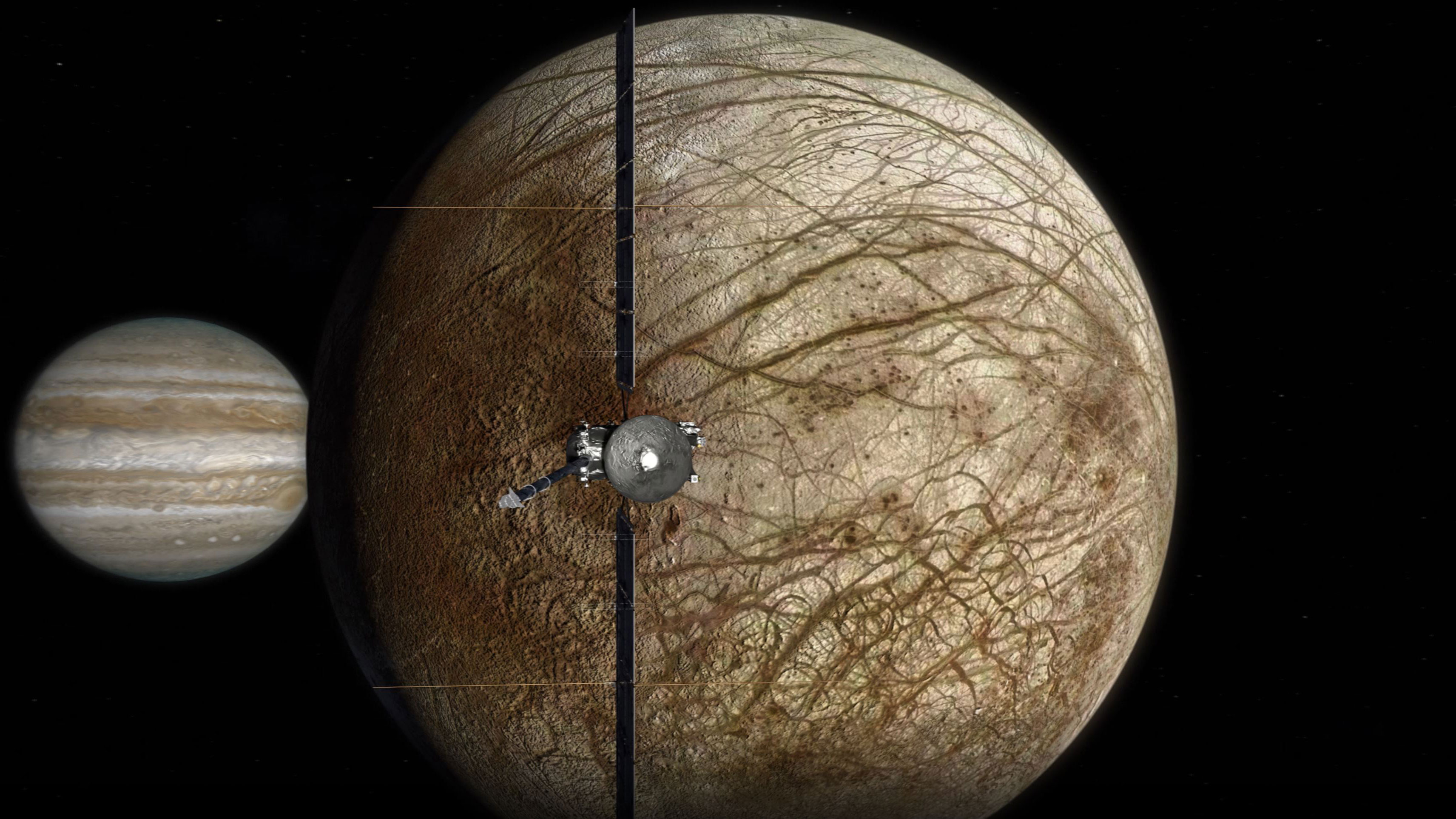 An illustration of Europa Clipper flying by Europa with Jupiter behind Europa.